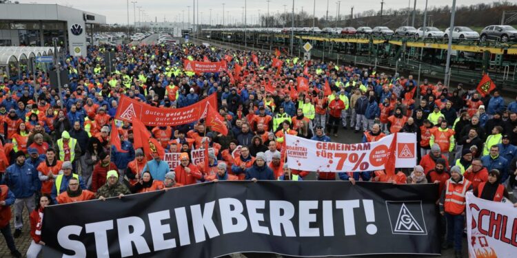 Volkswagen workers walk out on strike as German auto industry is engulfed in crisis