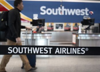 Southwest Airlines will start charging  for a checked bag tomorrow